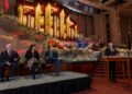 Mack Wilberg, Stephanie J. Block and Sebastian Arcelus sit on a platform as President Gary B. Porter speaks from a podium, during a news conference in the Conference Center in Salt Lake City on Friday, Dec. 12, 2025.