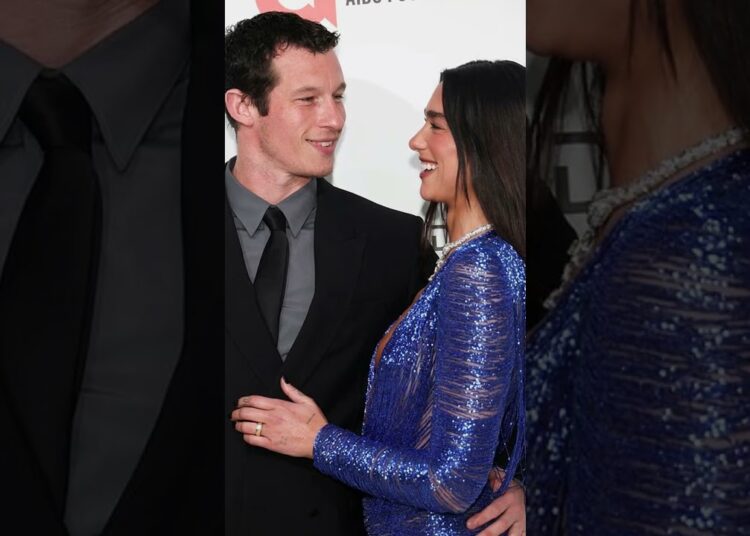 Dua Lipa Turns Heads in Plunging Blue Dress with Fiancé Callum Turner at Elton John’s Oscars Party 💙