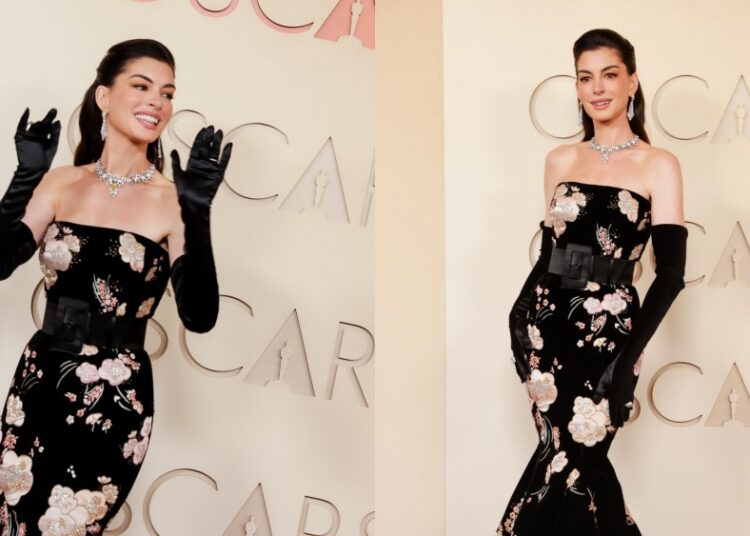 Anne Hathaway traz a alta costura floral Valentino para o tapete vermelho do Oscar 2026