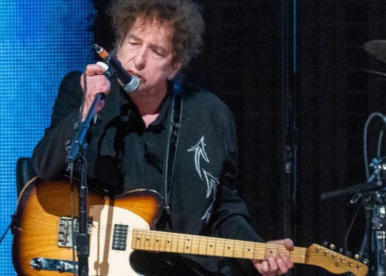 Um virtuoso da guitarra juntou-se à banda de Bob Dylan. Quanto tempo isso vai durar?