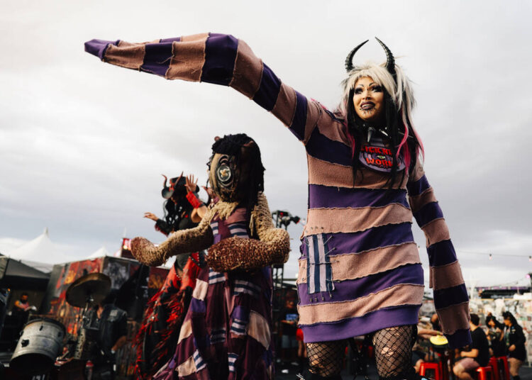 Performers dance on stilts during the the Sick New World music festival at Las Vegas Festival G ...
