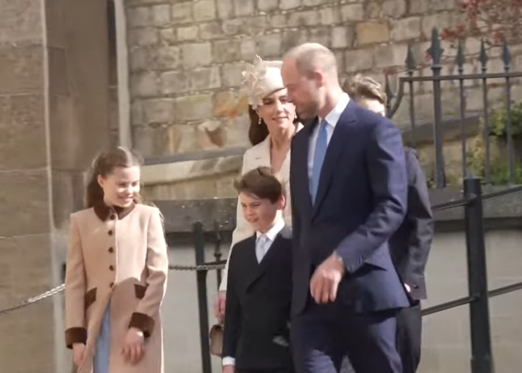 The Prince and Princess of Wales walk down the steep sloping pavement to the door of St. George