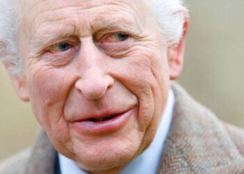 King Charles wears a sandy-coloured overcoat and white shirt while attending a service at the Church of St Mary the Virgin, close to the Sandringham Estate in Norfolk, England, on 26 January, 2025.