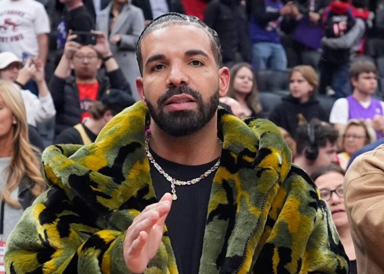 Drake claps at the end of the game between the Sacramento Kings and the Toronto Raptors during the second half of their basketball game at the Scotiabank Arena on November 2, 2024 in Toronto, Ontario, Canada.