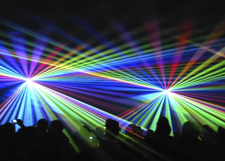 Concert lights beaming on audience