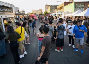 Thousands descend on Fulton Street as food vendors join clothing vendors and more during ArtHop, Thursday, Aug. 3, 2023 in downtown Fresno. Over time ArtHop has developed into much more than art gallery exhibits.