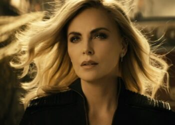 Charlize Theron stands with wind blowing in her hair in The Boys