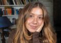 A smiling woman poses for a photo