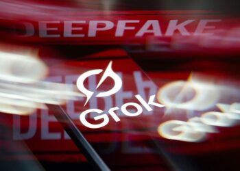 The Grok AI logo is displayed on a smartphone screen in this photo illustration(Photo Illustration by Jonathan Raa/NurPhoto)