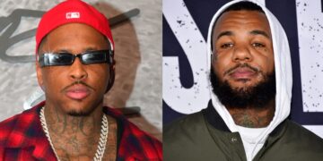 YG in a red cap and plaid shirt, wearing sunglasses and a chain. The Game in a hoodie and jacket, with a beard and tattoos.