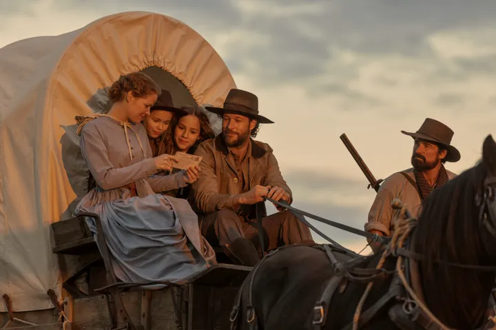 (L to R) Crosby Fitzgerald as Caroline Ingalls, Alice Halsey as Laura Ingalls, Skywalker Hughes as Mary Ingalls, Luke Bracey as Charles Ingalls, Warren Christie as John Edwards in "Little House on the Prairie."