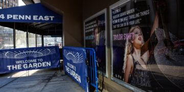 A poster featuring an image and quote from Taylor Swift is displayed outside Madison Square Garden in New York. (kena betancur / AFP via Getty Images)
